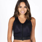 A woman modeling a black zip-up crop top with a scoop neck, shown against a plain white background.