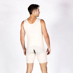 A man shown from the back wearing a light beige compression vest and matching compression shorts against a plain white studio background.